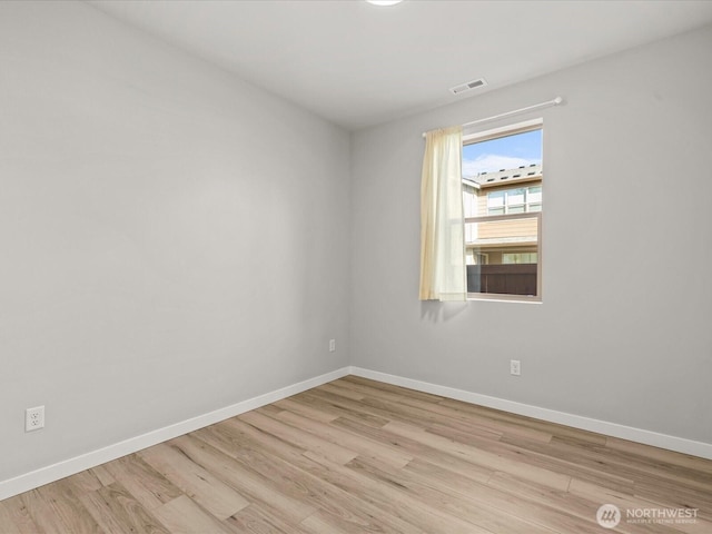 11521 SE 236th St, Kent, WA 98031 - spare room featuring baseboards and wood finished floors
