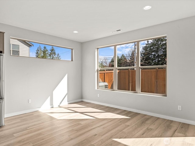 11521 SE 236th St, Kent, WA 98031 - empty room with wood finished floors, baseboards, and recessed lighting