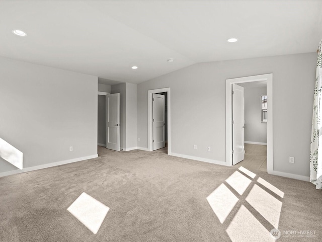 11521 SE 236th St, Kent, WA 98031 - unfurnished bedroom with a spacious closet, light colored carpet, baseboards, vaulted ceiling, and recessed lighting
