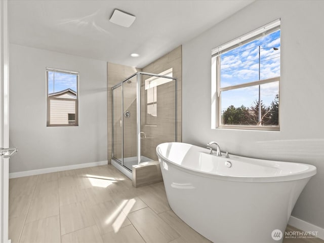 11521 SE 236th St, Kent, WA 98031 - full bath featuring a shower stall, a freestanding bath, and baseboards