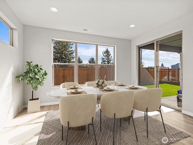 11521 SE 236th St, Kent, WA 98031 - dining space with plenty of natural light, wood finished floors, recessed lighting, and baseboards