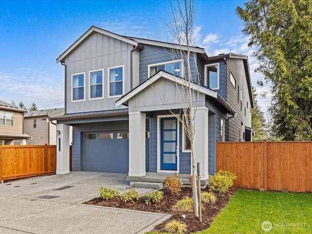 11521 SE 236th St, Kent, WA 98031 - contemporary house featuring board and batten siding, a garage, fence, and driveway