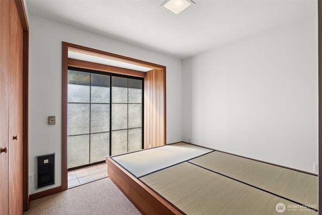 unfurnished bedroom with light colored carpet