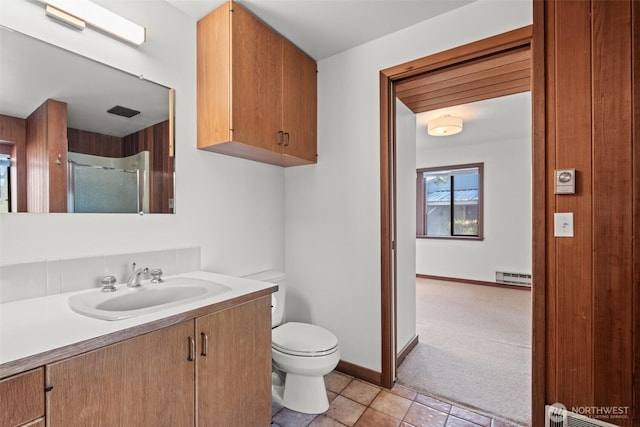 full bath featuring visible vents, a baseboard radiator, toilet, vanity, and an enclosed shower