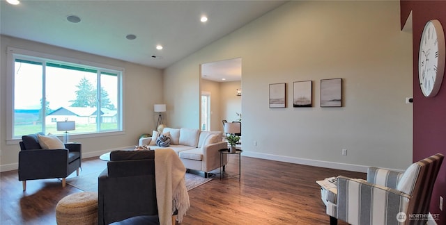living area featuring baseboards, high vaulted ceiling, wood finished floors, and recessed lighting