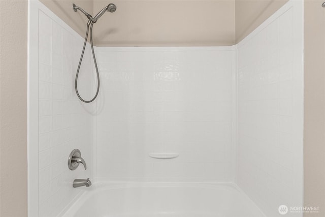 interior details with shower / washtub combination