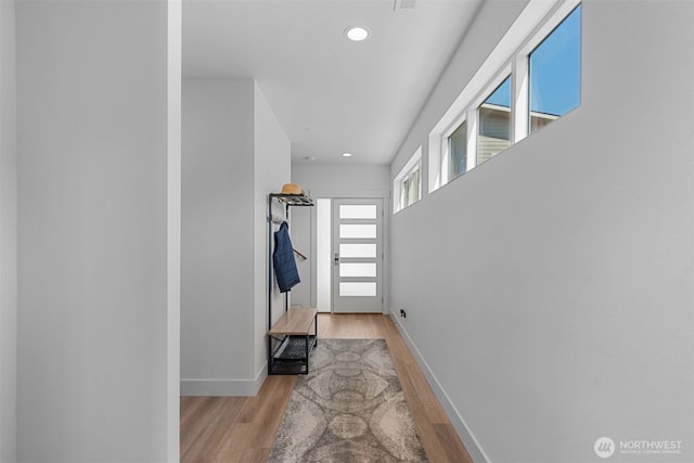 entryway with baseboards, recessed lighting, and wood finished floors