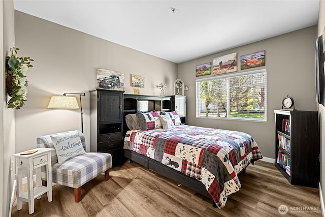 bedroom with wood finished floors
