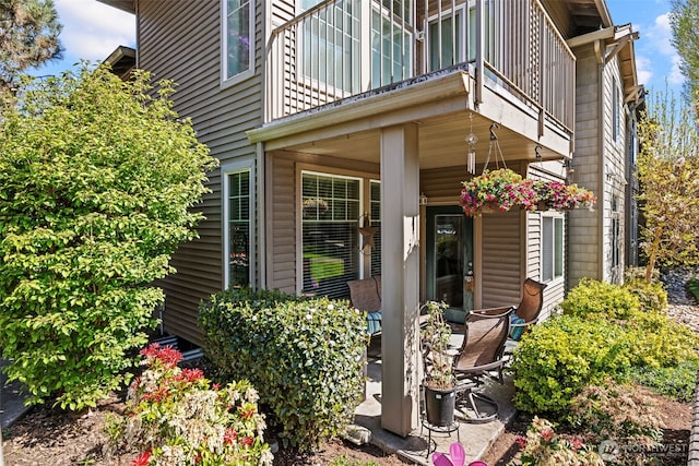 entrance to property featuring a balcony
