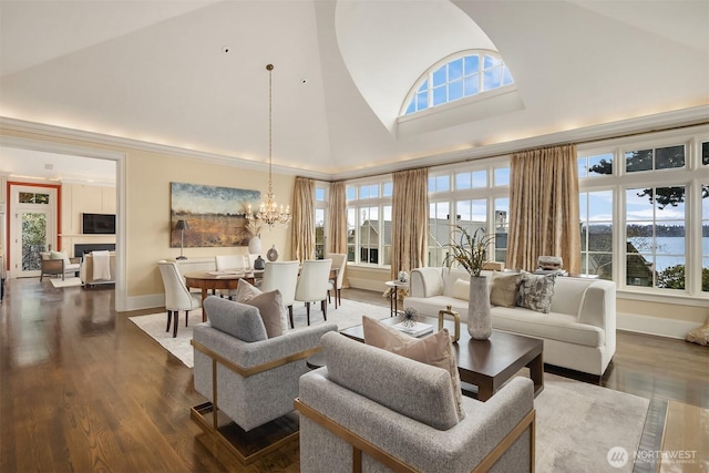 463 39th Ave E, Seattle, WA 98112 - living room with baseboards, high vaulted ceiling, a chandelier, and dark wood-style flooring