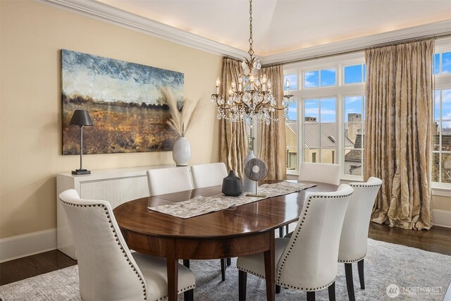 463 39th Ave E, Seattle, WA 98112 - dining space featuring an inviting chandelier, ornamental molding, wood finished floors, and baseboards
