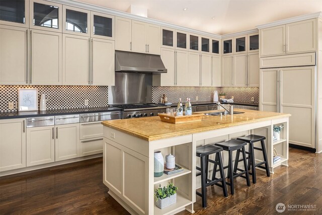 463 39th Ave E, Seattle, WA 98112 - kitchen with open shelves, range, under cabinet range hood, and a sink