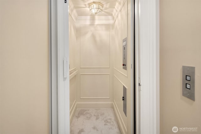 463 39th Ave E, Seattle, WA 98112 - room details featuring baseboards, crown molding, elevator, and carpet
