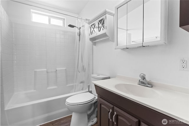 full bath featuring shower / tub combo, wood finished floors, toilet, and vanity