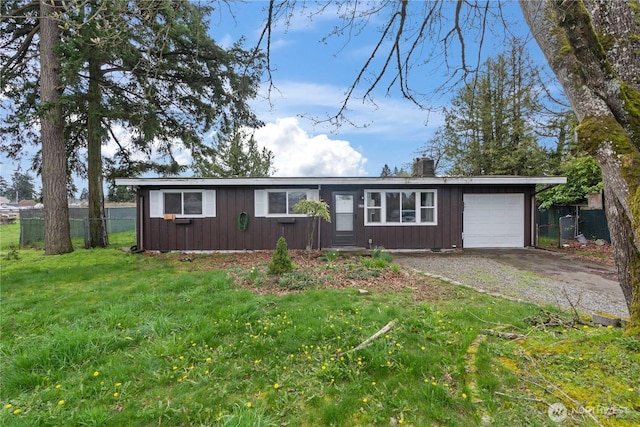 single story home with fence, an attached garage, board and batten siding, driveway, and a front yard