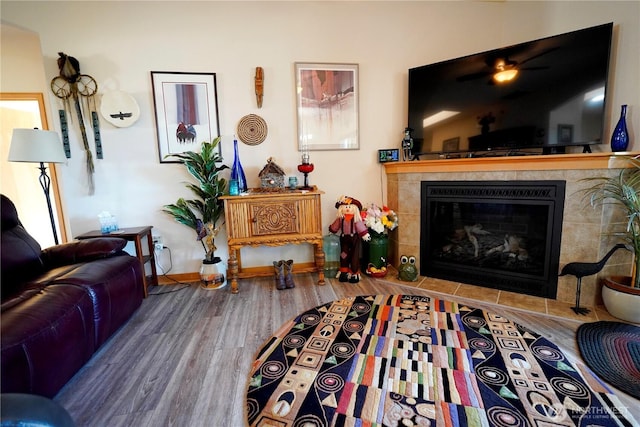 230 Choice Loop, Sequim, WA 98382 - living area with baseboards, a tiled fireplace, and wood finished floors