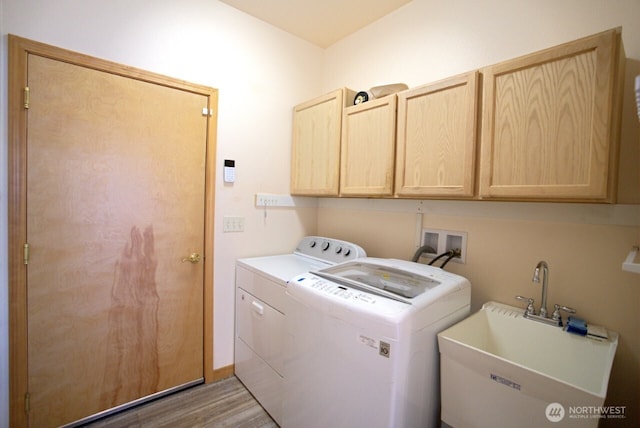 230 Choice Loop, Sequim, WA 98382 - laundry area featuring washer and dryer, cabinet space, and wood finished floors