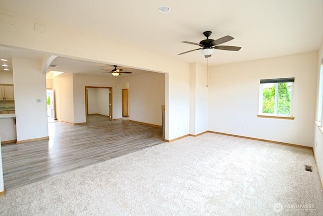 230 Choice Loop, Sequim, WA 98382 - unfurnished room with ceiling fan, light carpet, light wood-type flooring, and recessed lighting