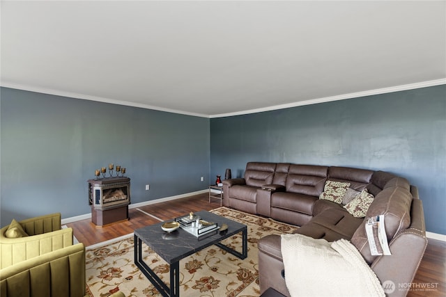 living area with ornamental molding, baseboards, and wood finished floors
