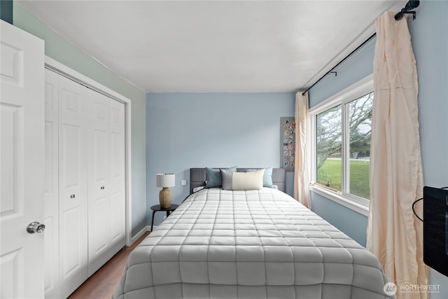 bedroom with a closet and wood finished floors