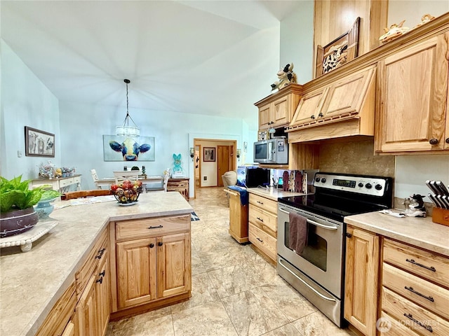 kitchen with light countertops, a chandelier, appliances with stainless steel finishes, hanging light fixtures, and light brown cabinets