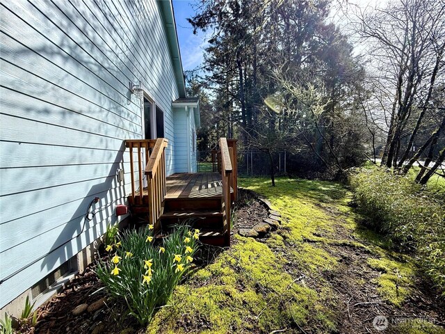 view of yard with a wooden deck