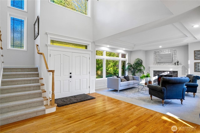 17955 SE 60th St, Bellevue, WA 98006 - entrance foyer with a high ceiling, stairway, wood finished floors, and a high end fireplace