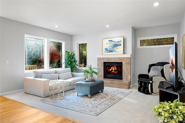 17955 SE 60th St, Bellevue, WA 98006 - living room with a tiled fireplace, wood finished floors, baseboards, and recessed lighting