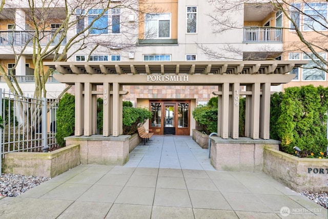 109 2nd St S Unit 337, Kirkland, WA 98033 - view of exterior entry featuring french doors, a patio area, and stucco siding