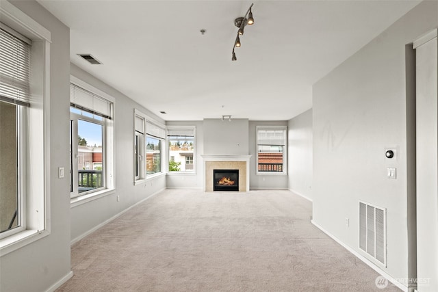 109 2nd St S Unit 337, Kirkland, WA 98033 - unfurnished living room with visible vents, baseboards, and carpet