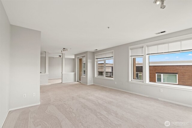 109 2nd St S Unit 337, Kirkland, WA 98033 - unfurnished living room with visible vents, light colored carpet, and baseboards