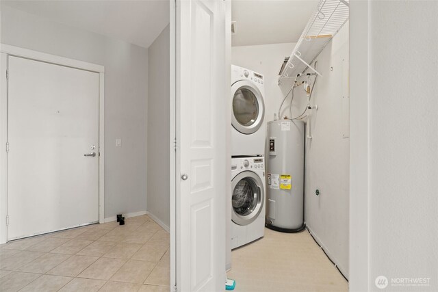 109 2nd St S Unit 337, Kirkland, WA 98033 - laundry area with water heater, laundry area, light tile patterned floors, and stacked washer and clothes dryer
