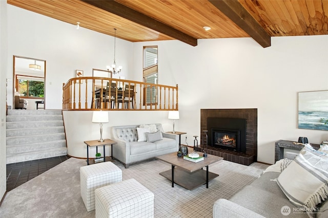 3429 167th Ave SE, Bellevue, WA 98008 - living room with wooden ceiling, a chandelier, a fireplace, beamed ceiling, and stairs