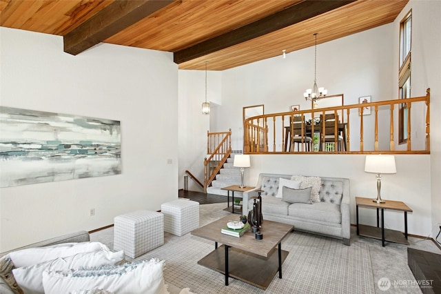 3429 167th Ave SE, Bellevue, WA 98008 - carpeted living area with a chandelier, beamed ceiling, wood ceiling, stairway, and baseboards