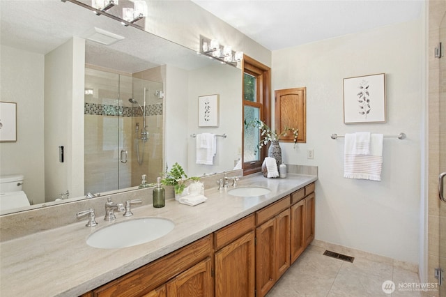 3429 167th Ave SE, Bellevue, WA 98008 - full bath featuring toilet, a stall shower, double vanity, tile patterned flooring, and baseboards