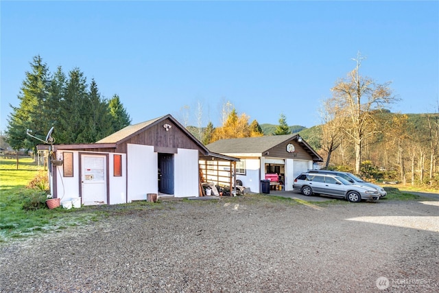 192 Meade Hill Rd, Glenoma, WA 98336 - view of front of house featuring a garage and an outdoor structure