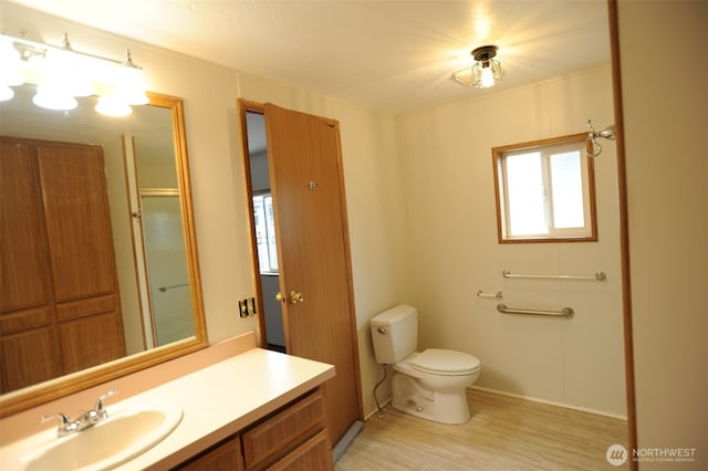 1415 84th St SE Unit 136, Everett, WA 98208 - bathroom featuring toilet, vanity, and wood finished floors