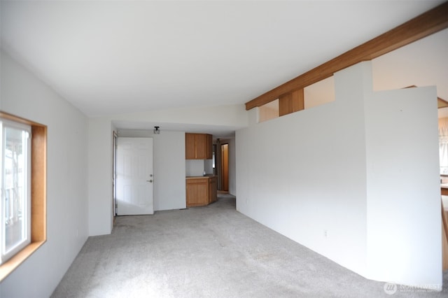 1415 84th St SE Unit 136, Everett, WA 98208 - unfurnished room with light colored carpet and vaulted ceiling