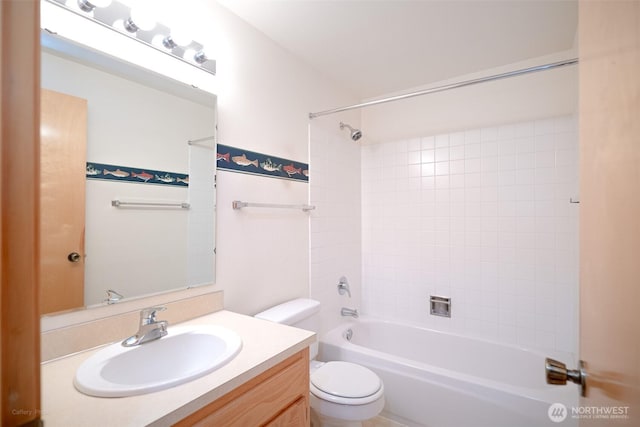 full bath featuring toilet, vanity, and shower / bathtub combination