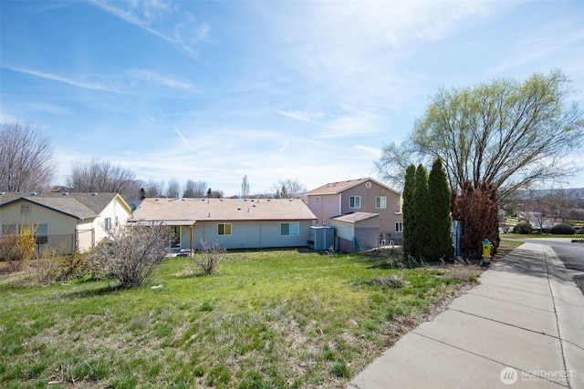 view of yard featuring a residential view and fence