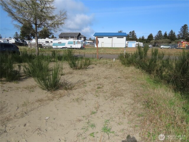 943 Silver King Ave SE, Ocean Shores, WA 98569 - view of yard with fence