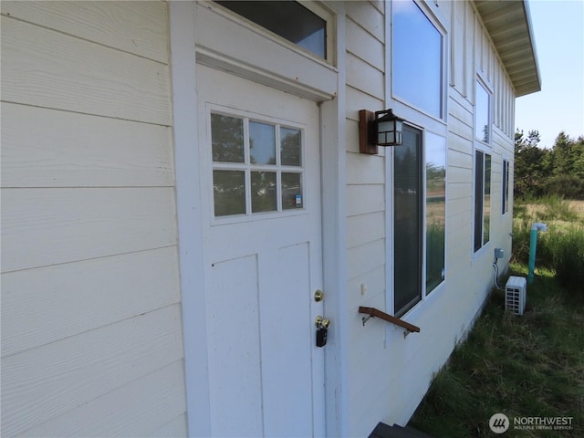 943 Silver King Ave SE, Ocean Shores, WA 98569 - property entrance featuring ac unit