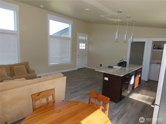 943 Silver King Ave SE, Ocean Shores, WA 98569 - dining room featuring dark wood-style floors and baseboards