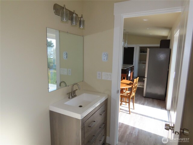 943 Silver King Ave SE, Ocean Shores, WA 98569 - bathroom featuring wood finished floors and vanity