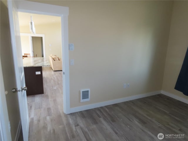 943 Silver King Ave SE, Ocean Shores, WA 98569 - spare room with wood finished floors and baseboards