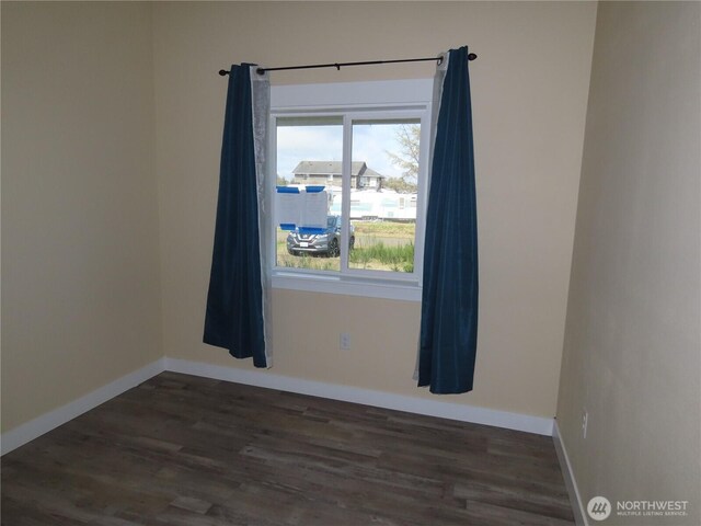 943 Silver King Ave SE, Ocean Shores, WA 98569 - empty room featuring wood finished floors and baseboards