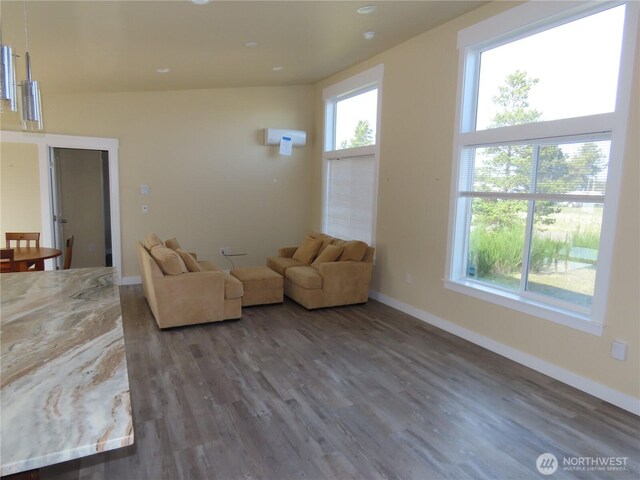 943 Silver King Ave SE, Ocean Shores, WA 98569 - living area featuring wood finished floors and baseboards