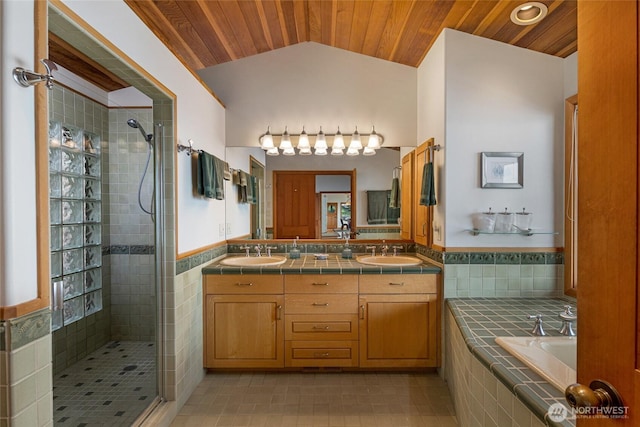 681 Smugglers Cove Rd, Friday Harbor, WA 98250 - bathroom with a tile shower, wood ceiling, and a sink