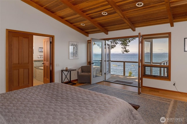 681 Smugglers Cove Rd, Friday Harbor, WA 98250 - bedroom with wooden ceiling, lofted ceiling with beams, a water view, access to outside, and wood finished floors