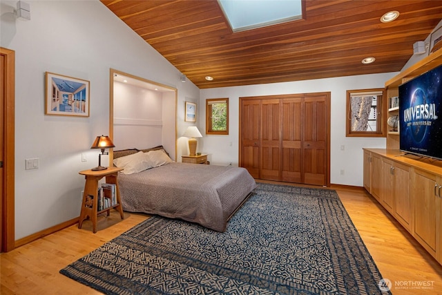 681 Smugglers Cove Rd, Friday Harbor, WA 98250 - bedroom with baseboards, lofted ceiling, wooden ceiling, and light wood-type flooring